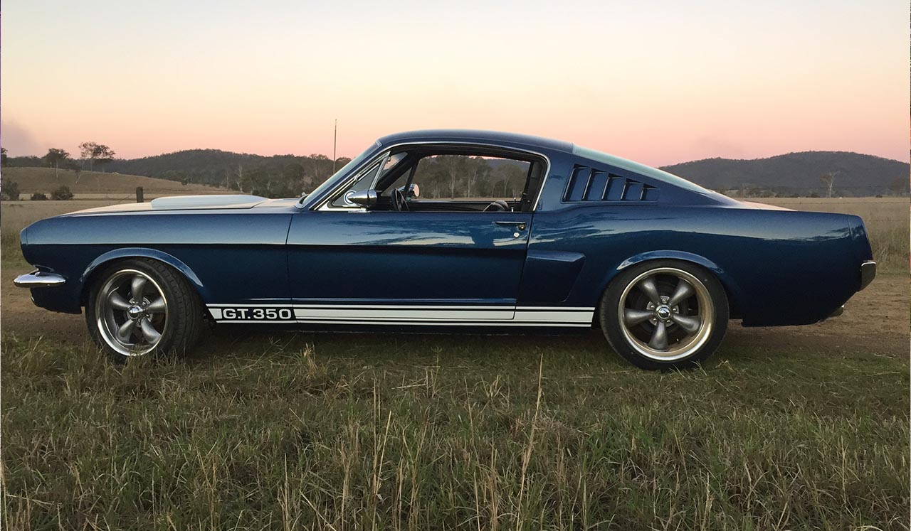 Blue Shelby 1965 Mustang Fastback side view