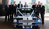 Front view Blue Shelby 1965 Mustang Fastback with groom and groomsmen wedding event Brisbane