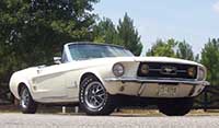 Wimbledon white convertible 1966 Mustang in a country setting